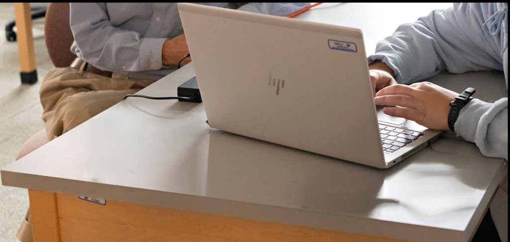 picture of person typing on a windows laptop